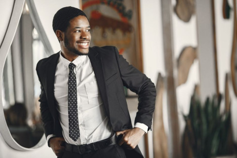 A confident, well-groomed man with a straight smile