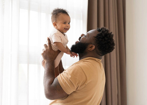 Man holding baby